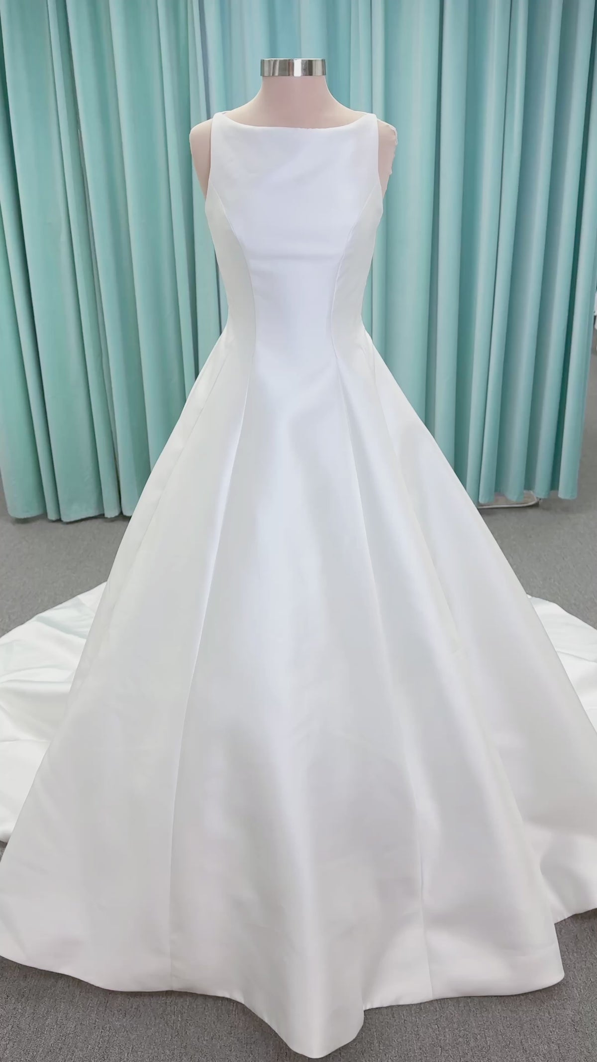 Morilee 1050007 Sylvia modest A-line wedding dress on mannequin with high neckline, crystal and pearl beaded embroidery, and flowing chiffon skirt