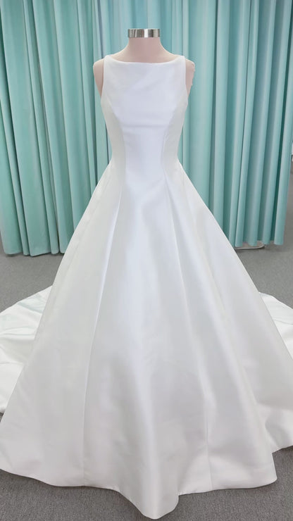 Morilee 1050007 Sylvia modest A-line wedding dress on mannequin with high neckline, crystal and pearl beaded embroidery, and flowing chiffon skirt